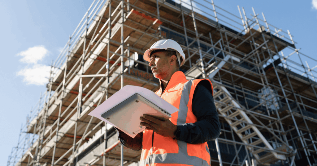 Construction company worker reviewing documents for marketing