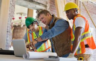 Contractors reviewing lead generation and web development for construction companies