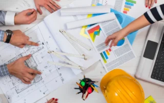 A group of digital marketers reviewing data for construction company marketing strategies