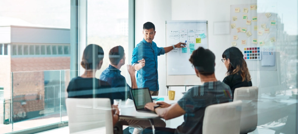 A corporate meeting between b2b marketing partners to review performance data