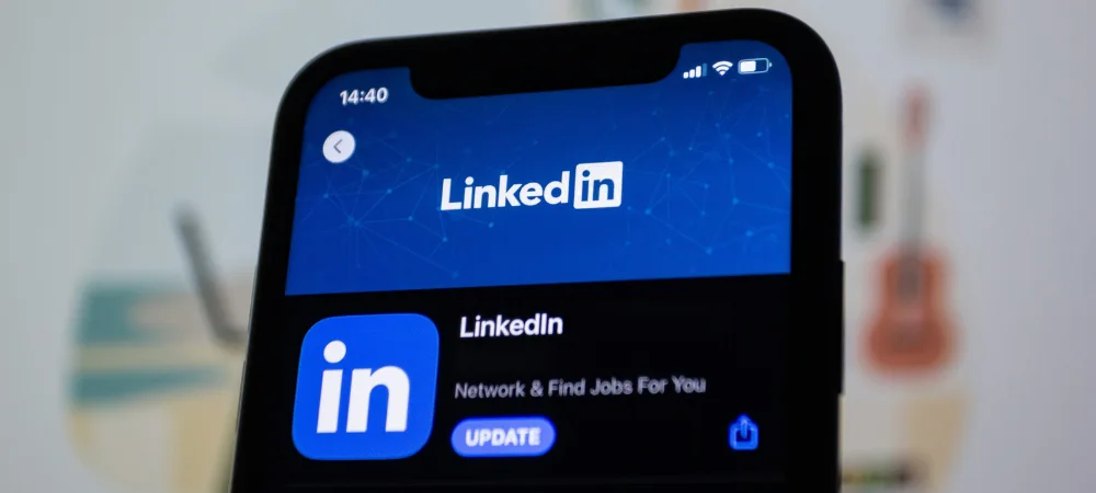 Business owner viewing the LinkedIn app in the app store to begin generating Leads with LinkedIn for the construction industry